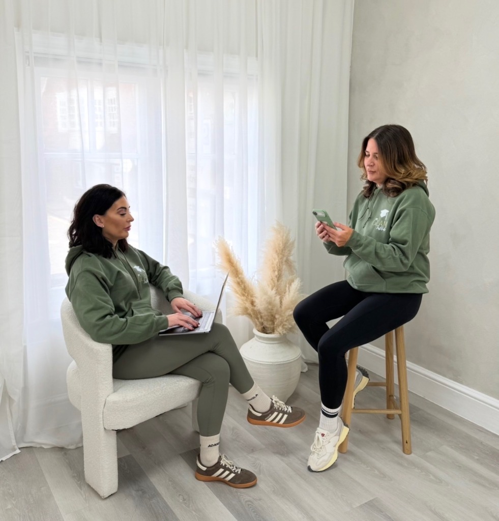 Georgina and Serena collaborating in brand hoodies